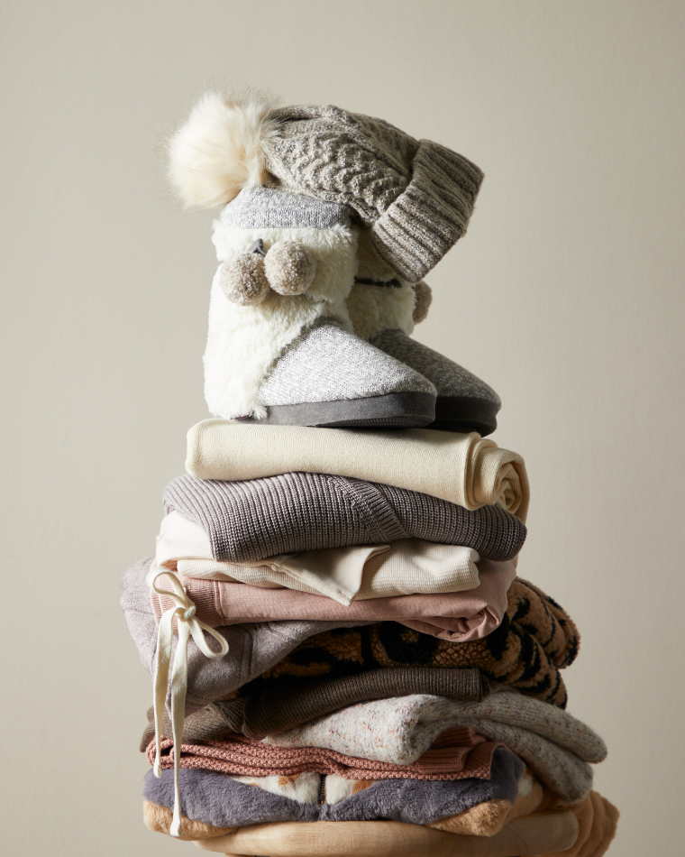 Stack fo sweaters and fall clothing from Wantable Cozytober Edit