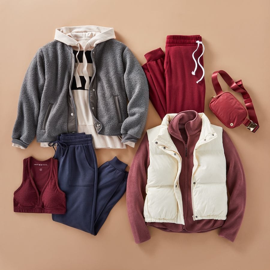 Striped hoodie, sherpa jacket, jewel toned joggers, sports bra, fleece jacket, puffer vest, and belt bag.