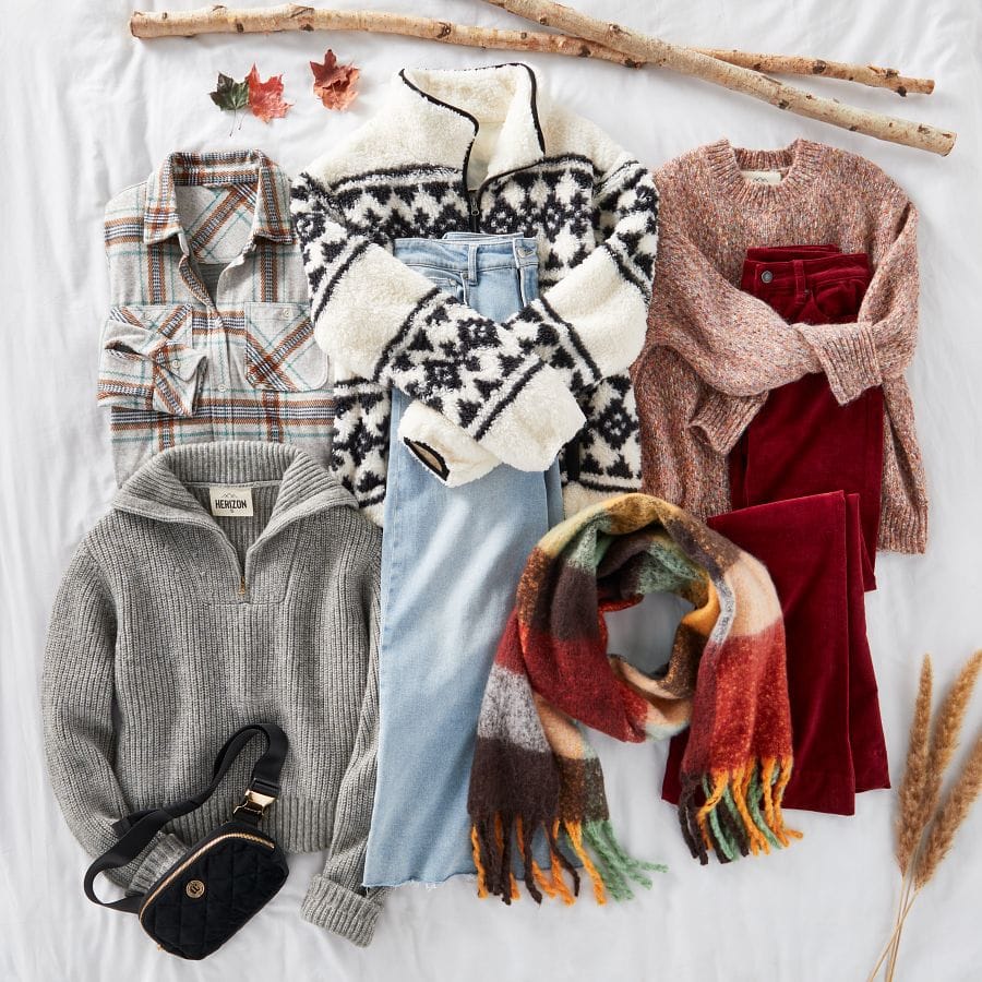 A plaid shacket, sherpa pullover, cozy sweater, quarter-zip ribbed sweater, wide leg jeans, a plaid scarf, velvet pants, and a belt bag laid out in a fall setting.