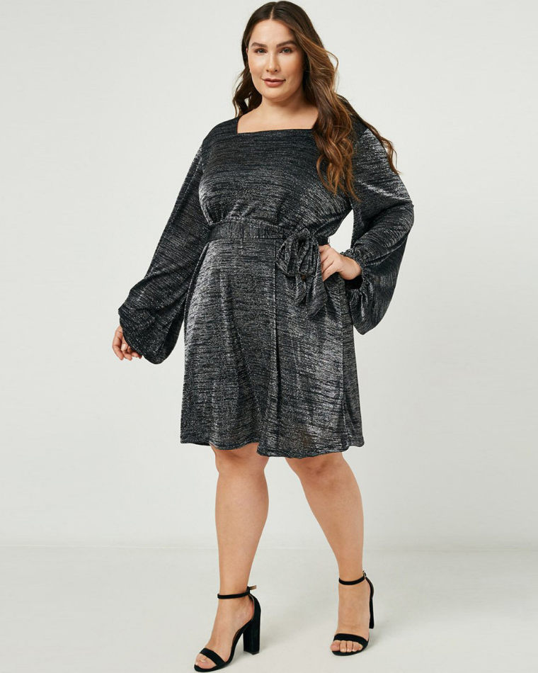 woman in a plus-size black metallic knit dress from Wantable Style Edit