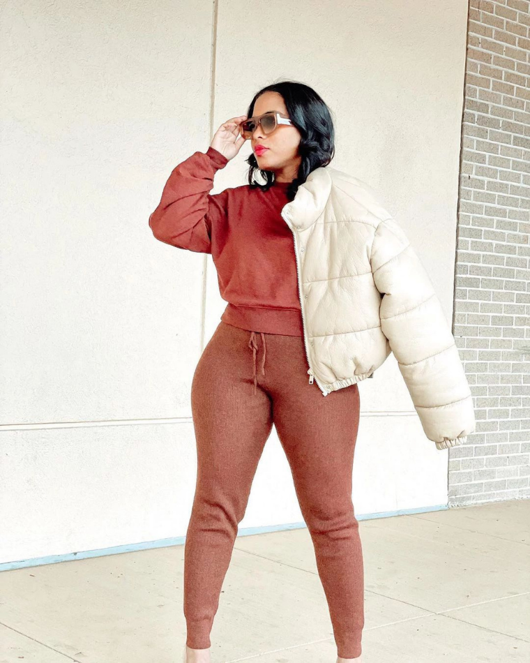 Woman walking outside in jewel tone colors and puffy coat from Wantable - @thatcoleaffect