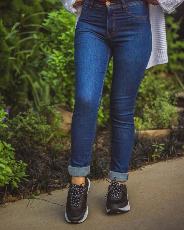 A basic pair of blue skinny jeans—which are back in style according to 2025 denim trends.