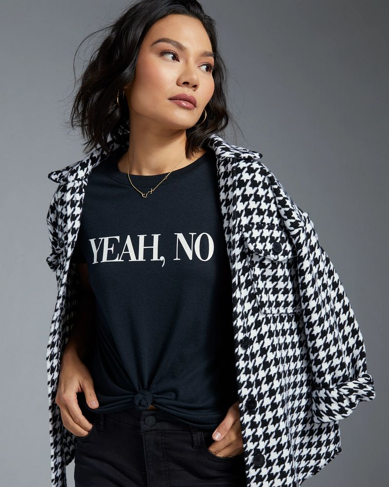 graphic tee with a statement shacket and black denim
