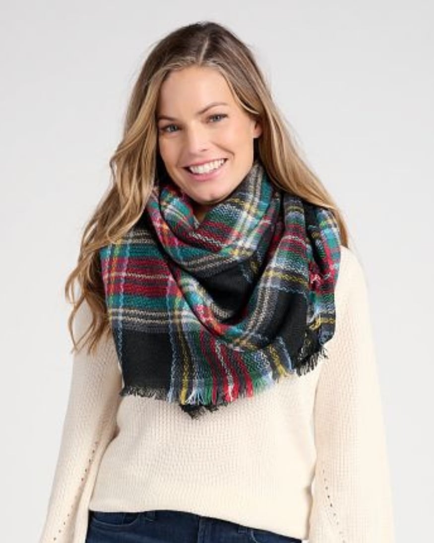 Model wearing a comfy plaid scarf. 