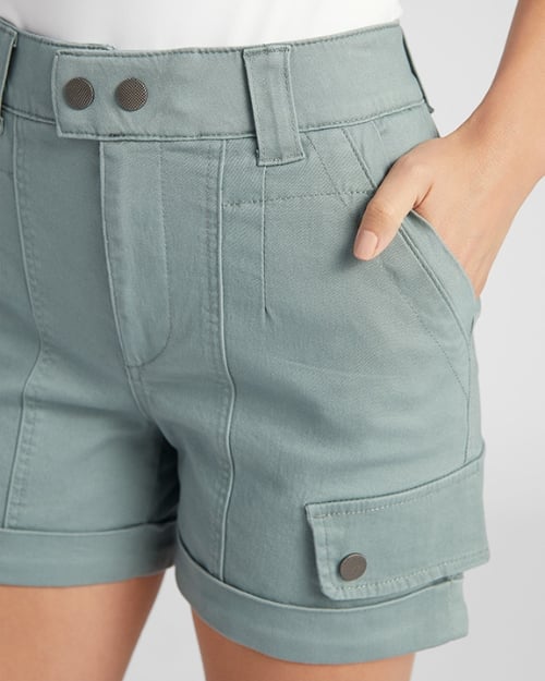 An up-close photo of a Wantable model wearing a pair of cargo shorts. One hand is in her pocket.