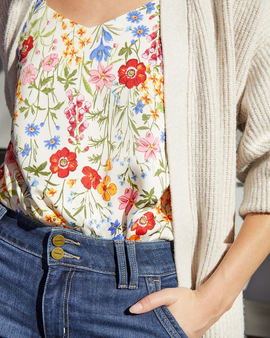 Close up of layering for a backyard party with a floral blouse and cardigan.